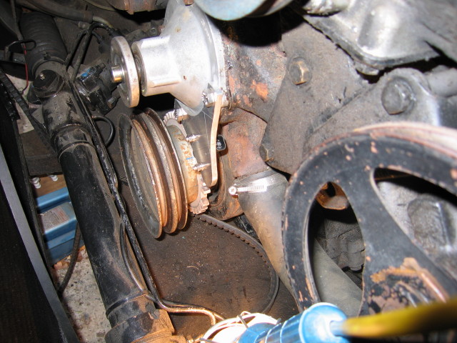 The VR sensor mount picks up the water pump mounting bolts.  The commonly used VR sensor with cranked end connection did not fit so I used one from an Australian EF Falcon with straight connection.  I bored the 36-1 wheel for heat shrinking onto the back 