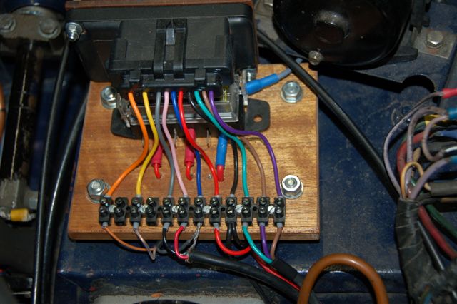 Notice the brown/purple wire switched it over to get another firing sequence from the coil, normally A,C,B with the wires switched it is A,B, C allowing to put the plugleads without crossing (depending of your firingorder of course)